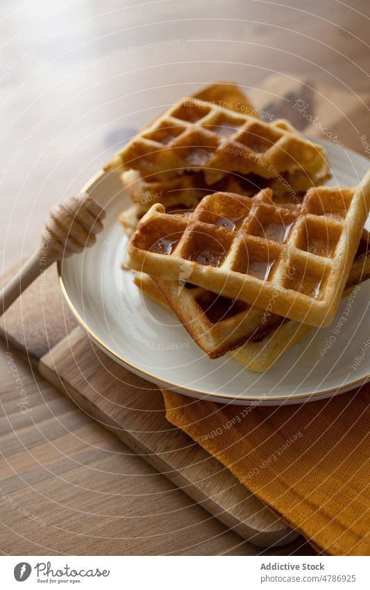 Delicious waffles served on ceramic plate dessert sweet homemade food baked culinary dipper tasty delicious yummy pile appetizing table kitchen sugar cuisine