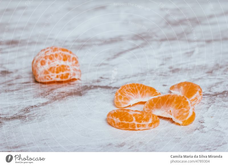 Tangerine peels in clean marble. antioxidant background citrus closeup color composition diet food fresh fruit healthy isolated macro nature nobody nutrition