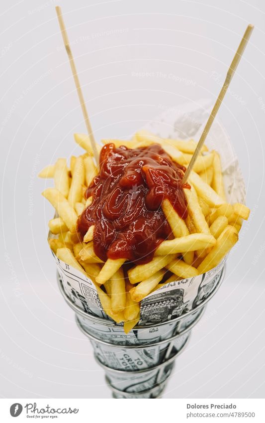 fries cone with ketchup ready to go american appetizer background baked basket bucket calories carton chips closeup color container cooked crispy cuisine