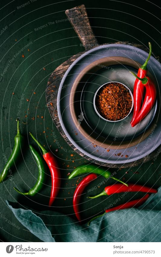 Chilli powder spice in a bowl on a rustic table chilli seasoning Chili Tangy Red Powder Rustic Herbs and spices Colour photo Vegetable Spicy Interior shot