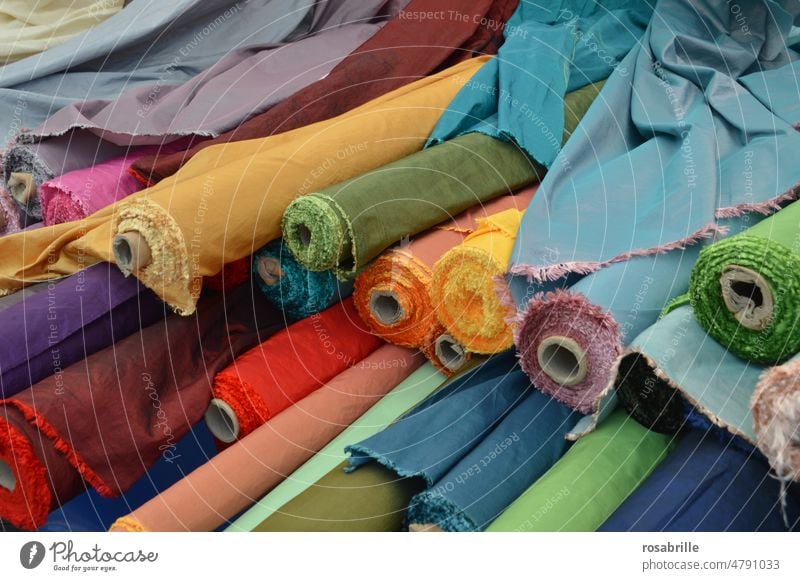 in the clothes | workshop | fabric rolls Substances fabrics Cloth textile Sewing Tailor's shop Load Fabric store sale Selection variegated Multicoloured Many