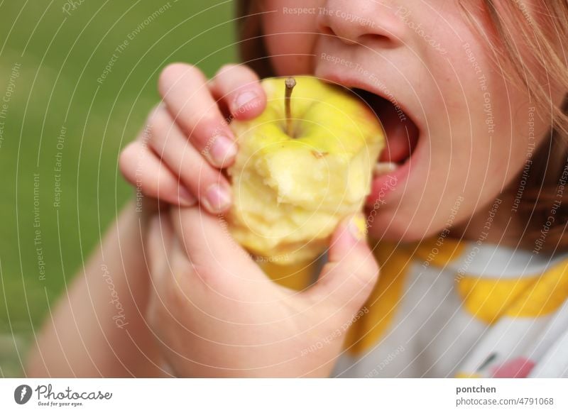 A child bites into an apple. Healthy food. Child Bite Apple Eating Healthy Eating vitamins fruit Infancy Tooth space Food Delicious Fresh naturally