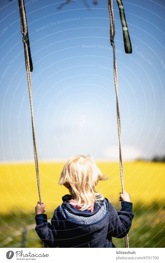 Girl on a swing in the countryside Swing Playing To swing Infancy Playground Movement Joy Children's game Happy Ease Joie de vivre (Vitality) Happiness Summer