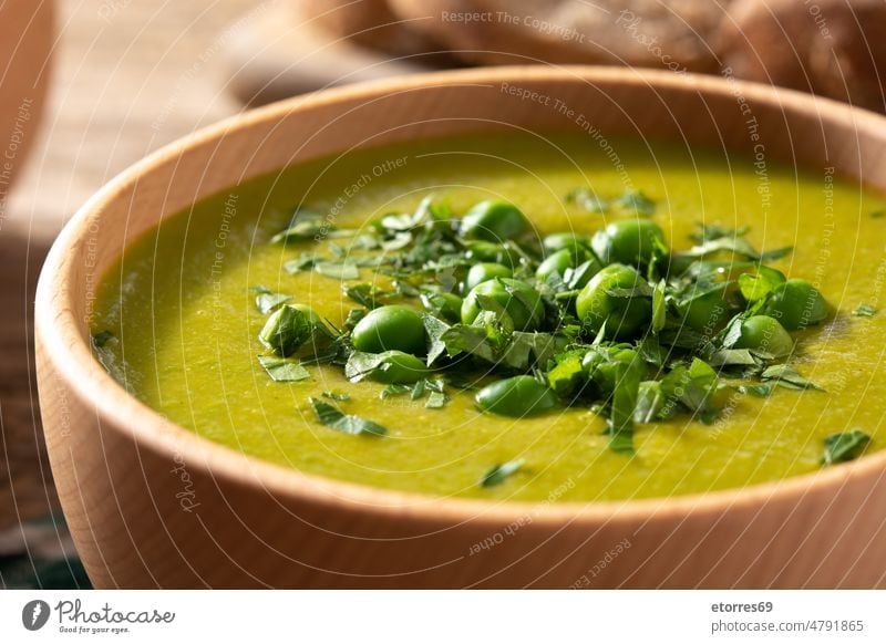 Green pea soup in a wooden bowl cooking cream creamy diet dinner food green healthy herbs meal nutrition vegan vegetarian veggie
