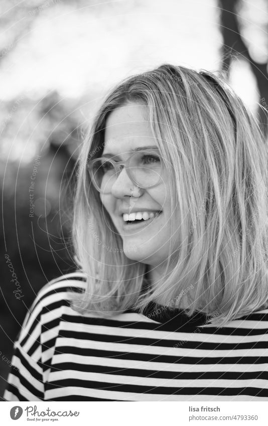 BLACK AND WHITE - GLASSES - MODERN Woman 25-29 years Blonde Eyeglasses Black & white photo Nasal piercing Nose ring Adults Exterior shot 20s Leisure and hobbies