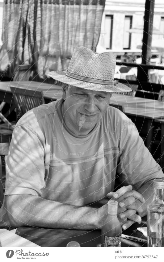 Summertime | heat wave | sitting in the shade | resting | waiting for food. Human being Man more adult Holidaymakers black and white photo Sit tired Smiling