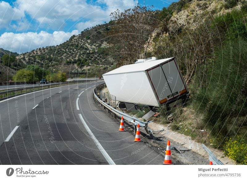 Refrigerated truck that has suffered an accident due to going off the road, leaving it off the road but without overturning. refrigerated truck sleep crash