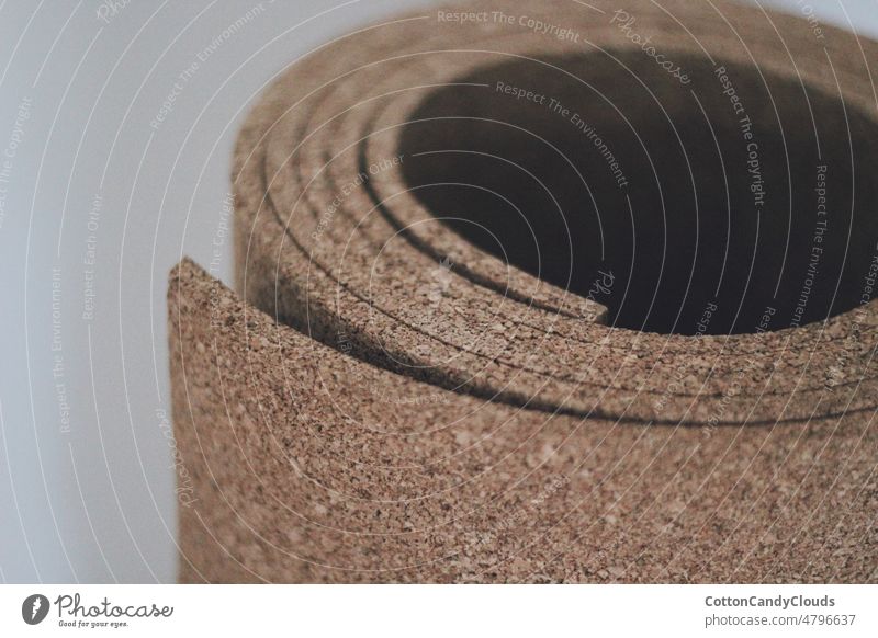 Close up of a roll of cork to put on a wall close up brown natural material texture object closeup surface decoration design pattern abstract close-up