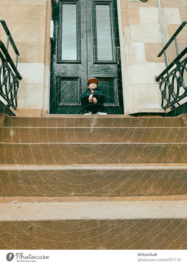 Waiting in Glasgow / boy in front of entrance door in Glasgow Boy (child) Boredom waiting bub Jack Child House (Residential Structure) Lifestyle Infancy