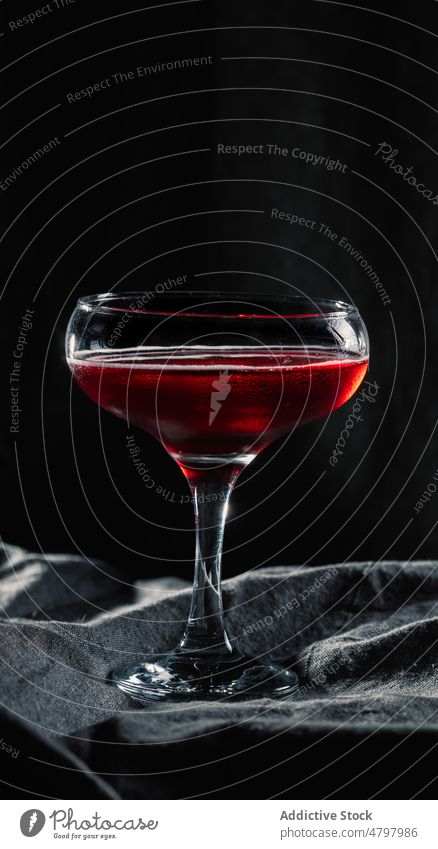 Red wine in wineglass alcohol red wine drink booze beverage aperitif flavor liquid goblet transparent table crystal taste fragile still life clear style studio