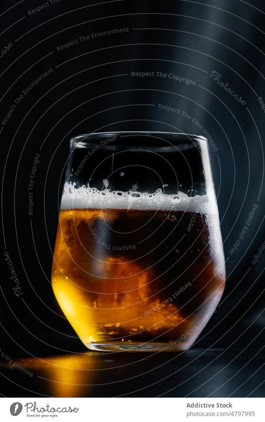 Glass of beer on table froth alcohol drink booze beverage aperitif flavor style serve liquid glass transparent crystal taste foam fragile still life clear