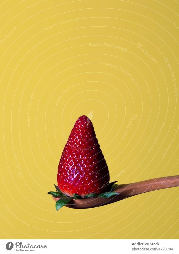 Strawberry on spoon in studio strawberry healthy food vitamin organic natural flavor style product leaf tasty fresh red sweet vivid delicious whole light color