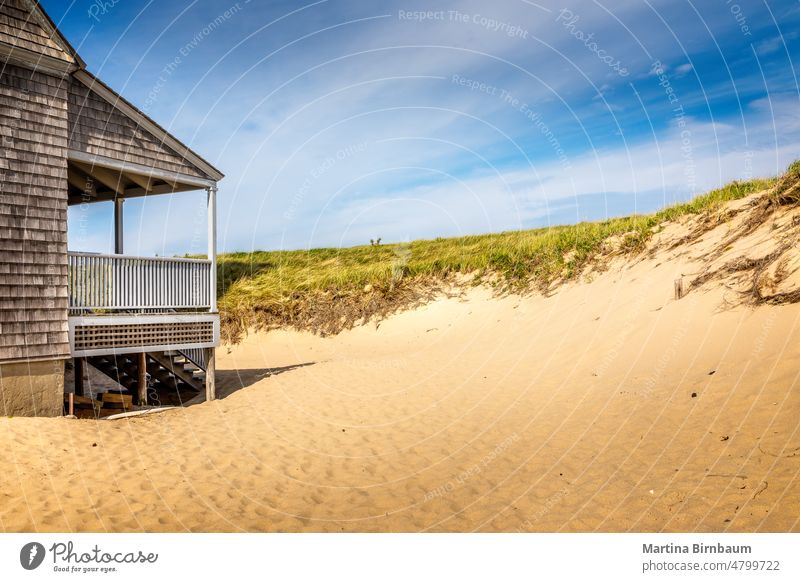 A part of the life saving station building in Provincetown with dand dunes and gras, copy space landscape nature travel boardwalk vacations beach outdoors