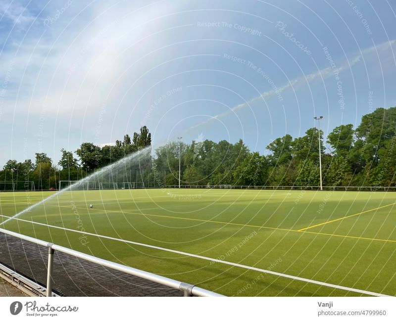 Empty soccer field with water sprinkler Lawn Artificial lawn Green Sports out Foot ball Line Football pitch Playing field Sporting grounds Leisure and hobbies