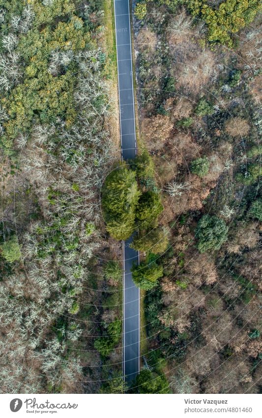 zenithal aerial view of a asphalt road on a hillside europa country nobody open road drone view aerial photography long road mountains top perspective freedom