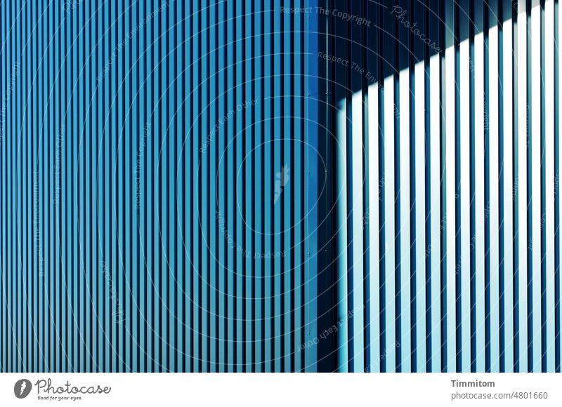 Blue façade with light and shadow Facade chill Design lines Black Shadow Corner Light Bright Structures and shapes Building Exterior shot Architecture Contrast