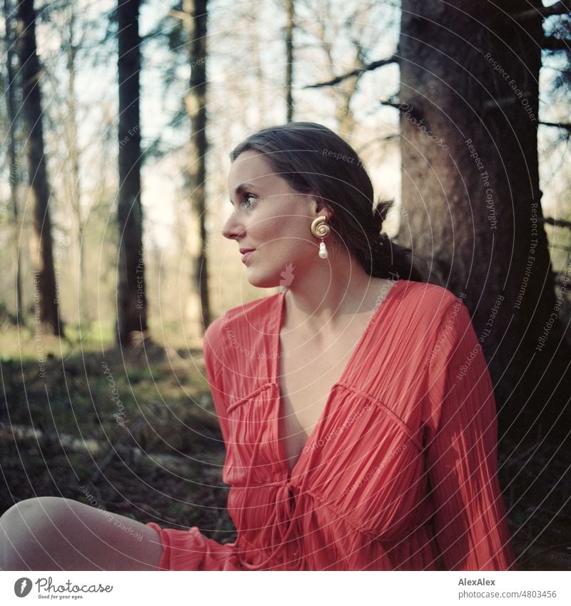 analog medium format portrait of young woman in orange dress sitting in a forest Woman Young woman pretty Feminine feminine Identity Authentic Esthetic Adults