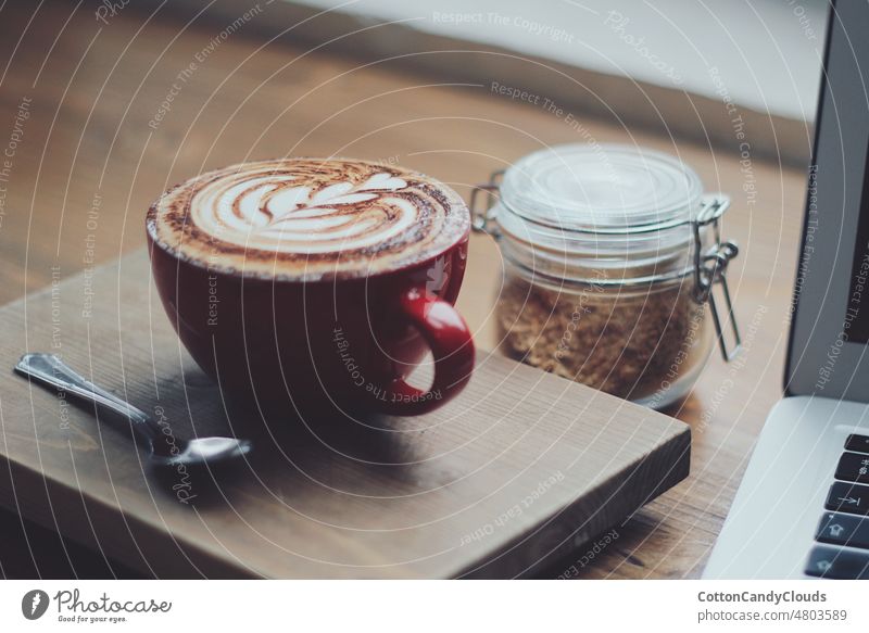 Cappuccino in a red cup and a jar with cereals cup of coffee cappuccino red coffee cup coffee bar espresso breakfast warm drink cosy morning food tea hot sweet