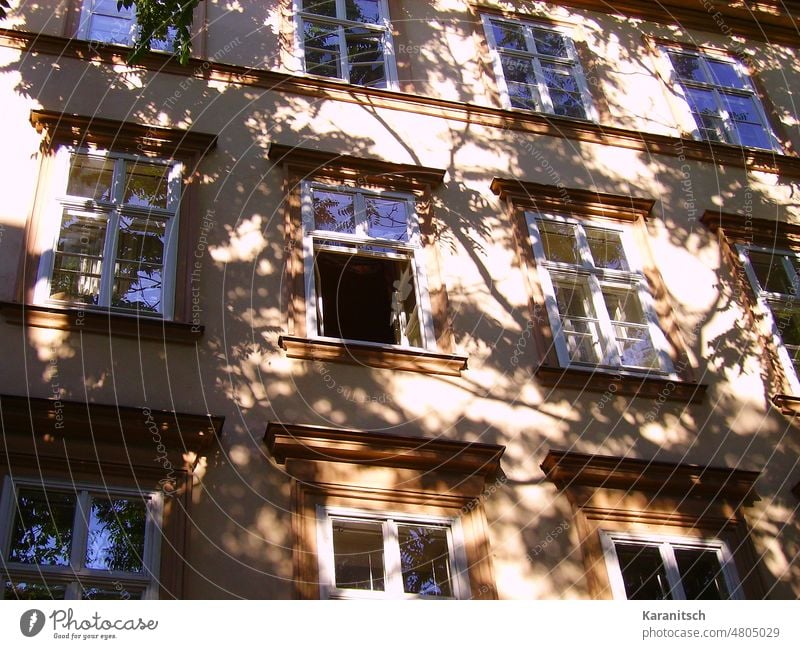 There is a shadow on a exterior wall; Spittelberg in Vienna Light morning morning sun silhouette house tenement hause front window open pictorial atmosphere