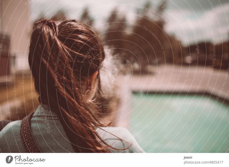 [hansa BER 2022] Woman smoking by the pool Young woman Smoking steam Cigarette Smoke Nicotine Addiction out Smoker e-zigarette Evaporator Lifestyle Ease Freedom