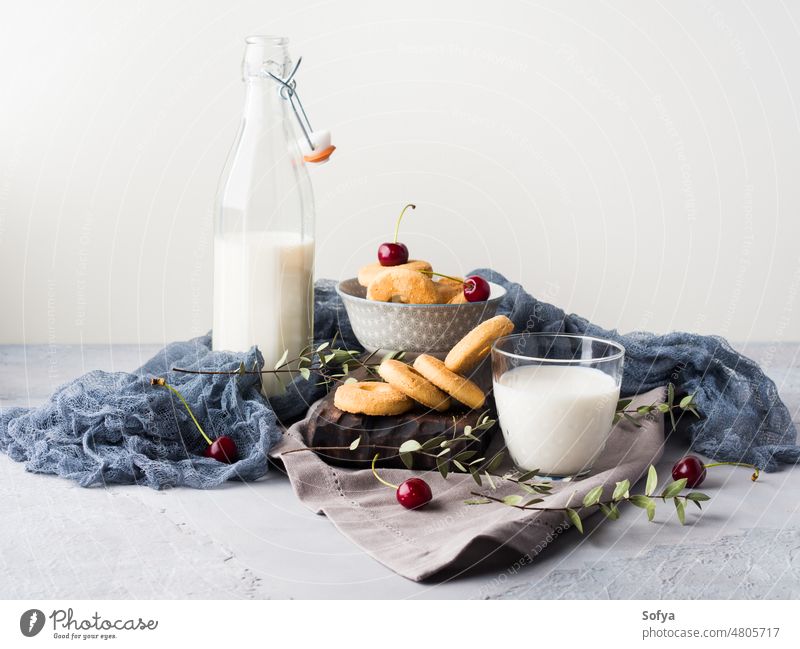 Rustic still life with milk and cookies glass table background breakfast food fresh dairy drink healthy natural nutrition summer wooden beverage calcium closeup