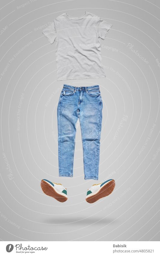 Flying clothes on gray background for mockup. tshirt jeans fly fashion casual footwear shop isolated t shirt denim shoes template white women accessory blank