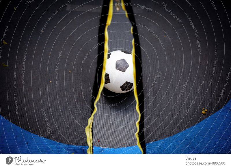 Soccer through a slit in the curtain on a trampoline Foot ball Game ball Ball Opening Drape entry Trampoline soccer game white-black Classic Ball sports