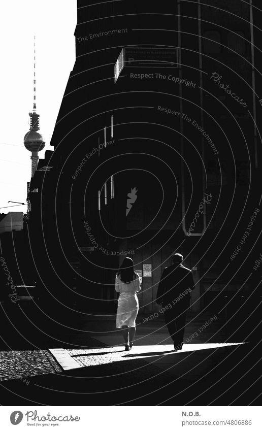 Berlin SW man and woman Downtown Berlin Capital city Exterior shot Town Berlin TV Tower Television tower B/W Black & white photo black-and-white