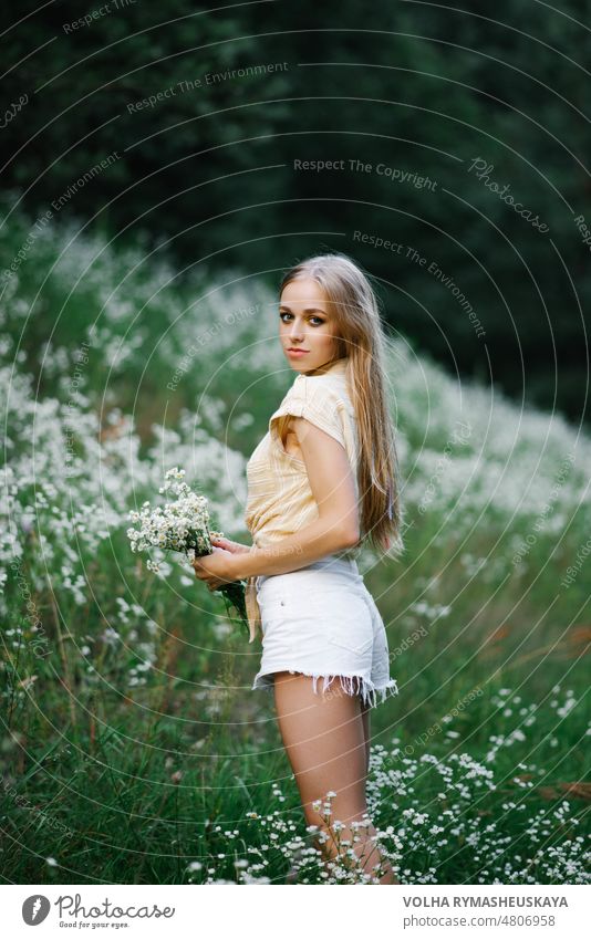 Portrait of a sweet gentle girl in a field of white flowers person meadow female woman beauty grass nature arms carefree freedom joy model outside happiness