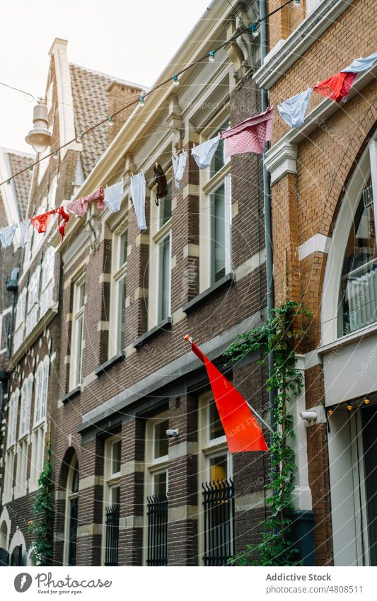 Facades of residential brick buildings in Netherlands facade street laundry city architecture exterior neighborhood district infrastructure clothesline