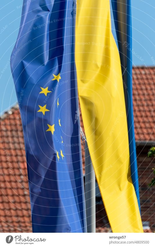 The European flag and the Ukrainian flag fly side by side on the flagpole Ukraine Politics and state Blue blue-yellow Judder Flagpole flag bearer Hang Suspended
