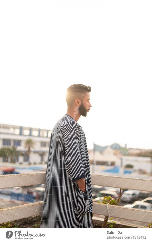 Young handsome male under the lovely sunset young Young man Beard bearded Beard hair Bearded man beard man Sunset sunset sky sunset mood sunset landscape