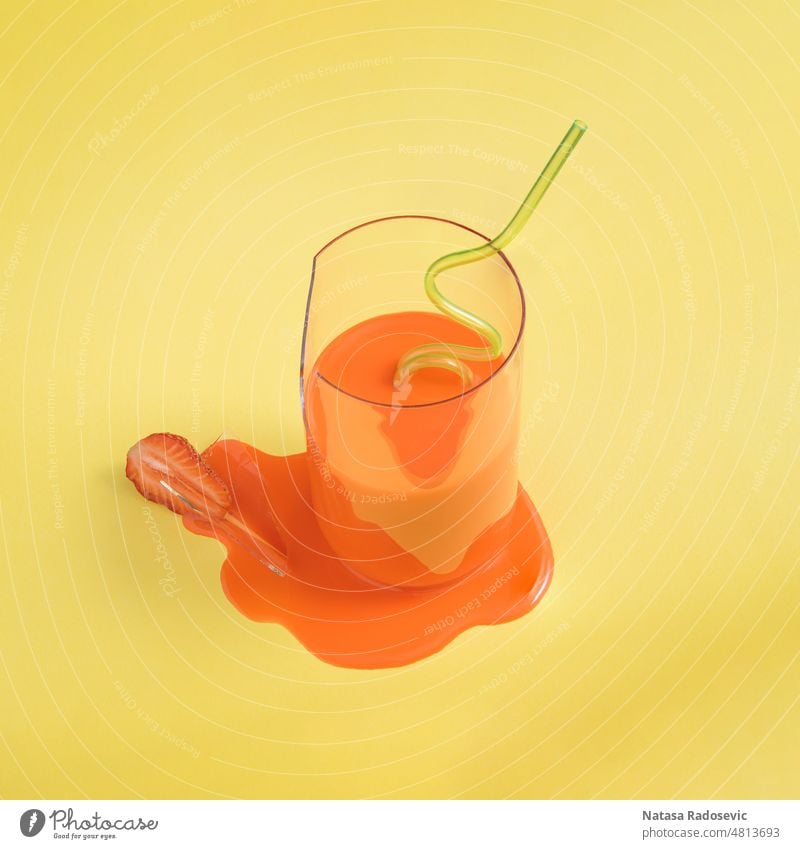 Strawberry juice poured from a broken glass with a drinking straw on a yellow background Abstract minimal summer tropical concept Contemporary Square aesthetic