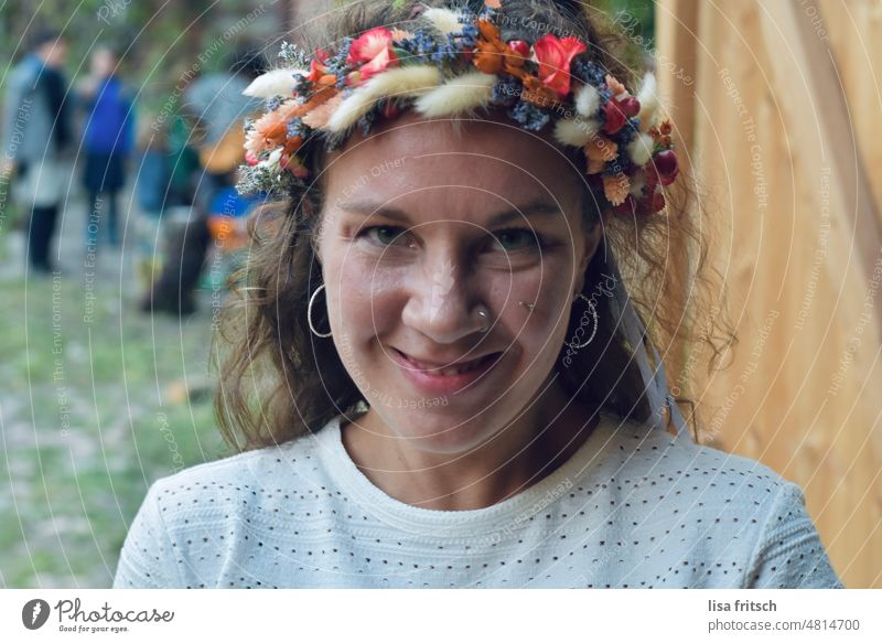 CHEERFUL - FLOWER WREATH - GRIN Woman 18 - 30 years Feminine Young woman Exterior shot Colour photo Brunette Curl Flower wreath Nose ring Grinning cheerful