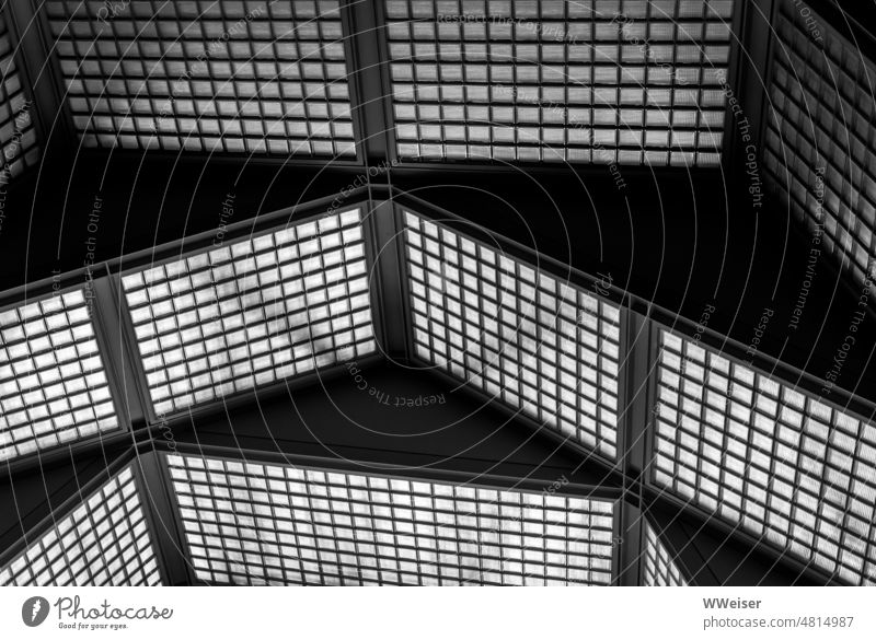 Square structures, arranged into rectangles, form an abstract geometry of light and shadow Window geometric square rectangular snapped off Bright Dark Light