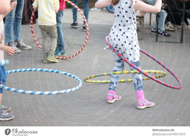 Kids playing with hula hoop children Hula hoop Feasts & Celebrations Children's Party Playing playing children variegated Street Street party Movement