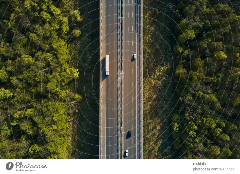 Aerial view of highway road with moving cars traffic aerial overhead city motorway freeway sky construction asphalt transport travel transportation driving