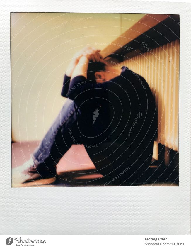 [hansa BER 2022] Fear eats up soul. Distress discouraged Man Heater Analog Polaroid hands Arm Head Crouch floor crouched sad Sadness posture Grief Loneliness