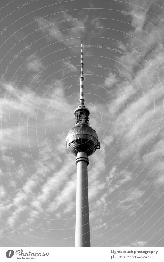 Berlin television tower against dramatic clouds. Vertical black and white image. Alexanderplatz Black & white photo Sky Clouds Tourism Architecture alex
