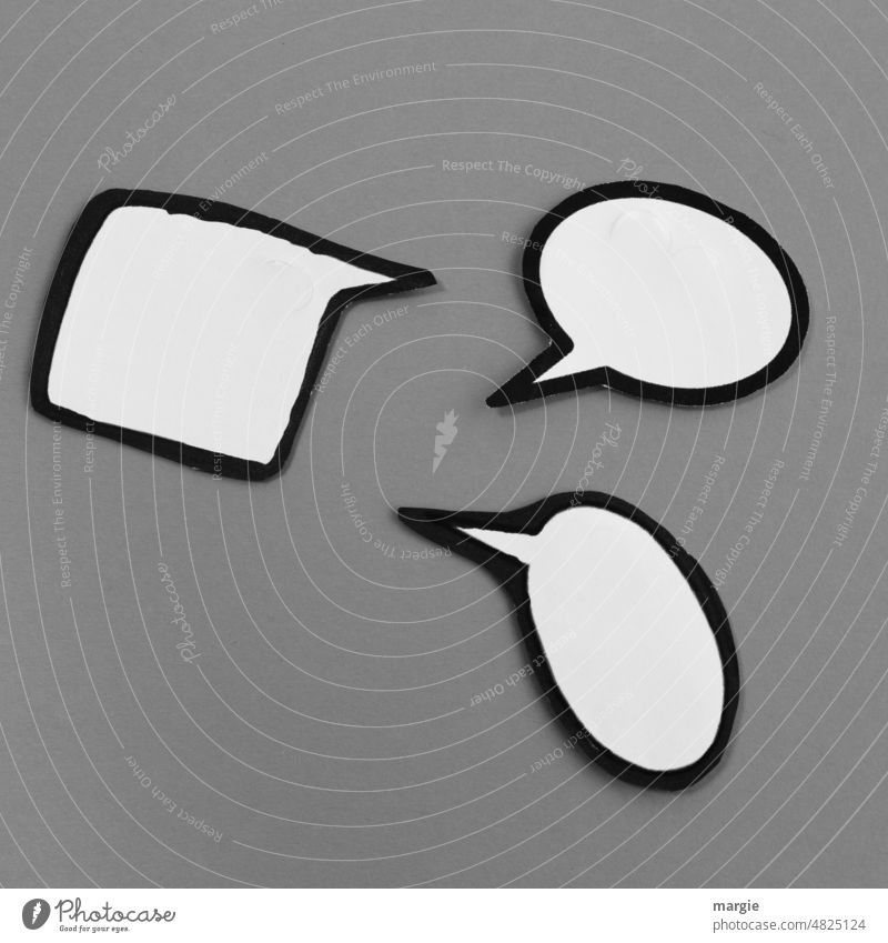 Three empty speech bubbles on gray background Speech bubbles communication three Gray Paper To talk Compromise Neutral Background Close-up Signs and labeling