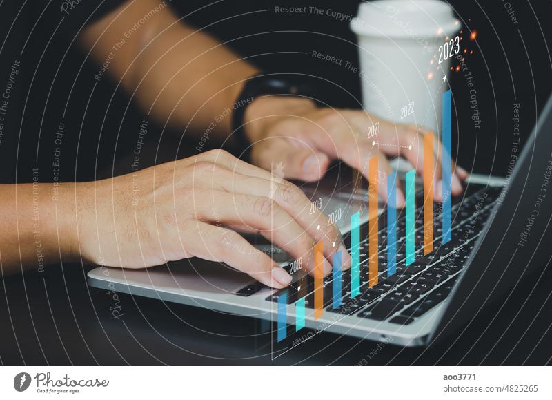 Business Analysis, Economic Growth, Finance with Virtual Graphs and Charts 2023.businessman using modern computer technology. finance graph growth analyzing
