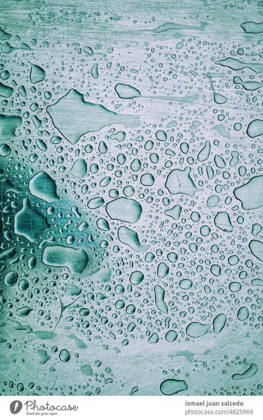 raindrops on the metallic surface droplet rainy rainy days water wet floor aqua ground abstract background pattern textured colors shiny bright gray grey