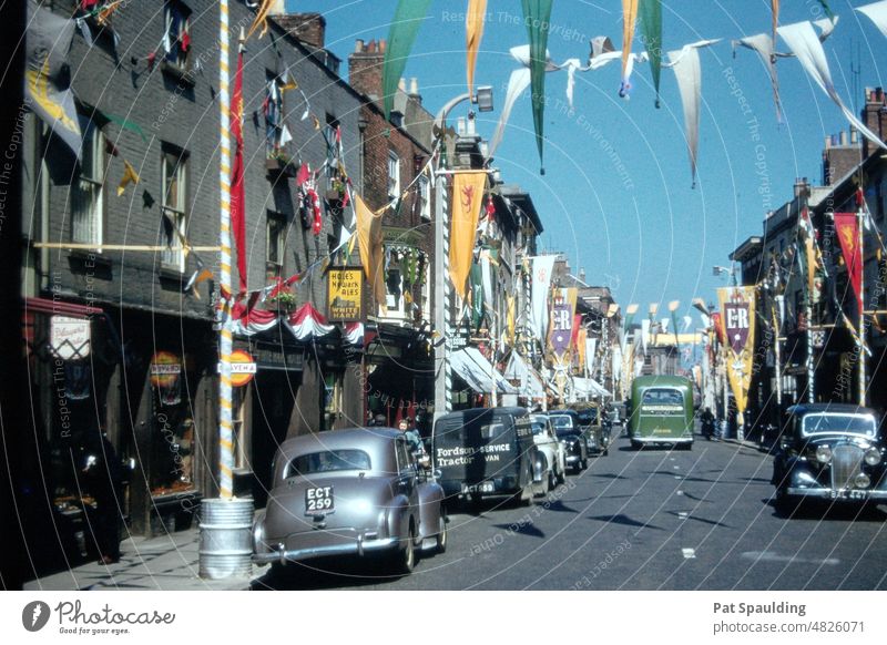 Street Showing Celebratory  Banners for the Coronation of Queen Elizabeth London England 1953 Vintage Cars Celebration Europe History Historic The Crown