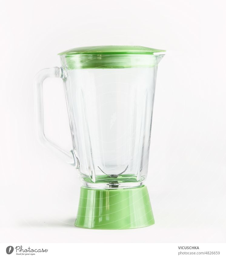 Empty green glass blender at white background. empty kitchen utensil healthy smoothie juice preparation home front view cooking object refreshment