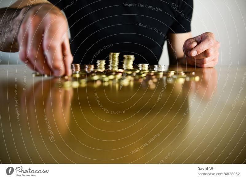 Man counts money Money Numbers Coin Poverty Luxury Poverty threshold Avaricious hands Euro concept Save finance Table