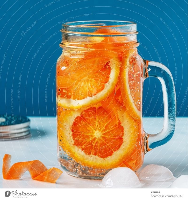 Vitamins to go: Refreshing cool mineral water with orange and carrot Beverage Cold drink Water Orange Glass handle Organic produce Fruit Drinking water