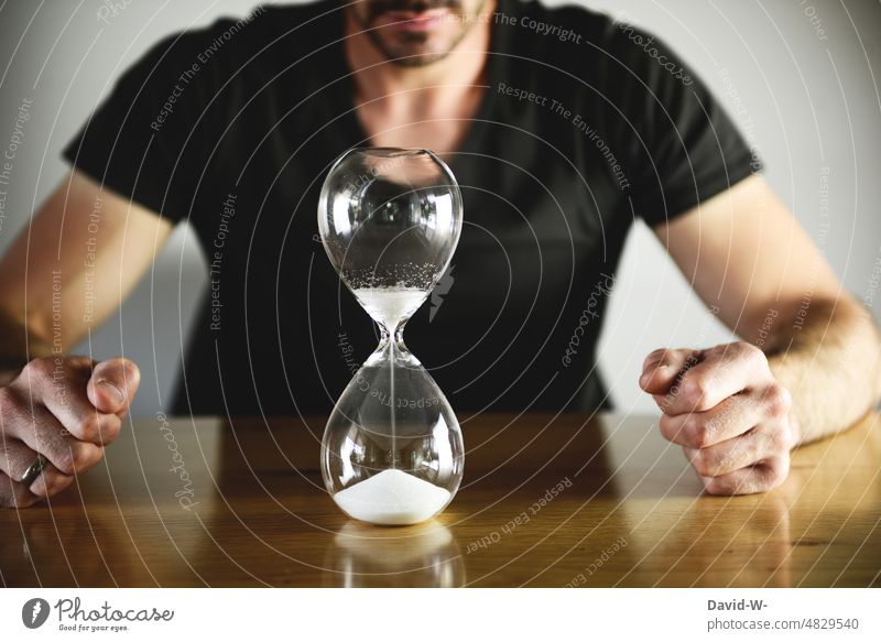Hourglass - time is running out time pressure Stress time management Time concept Man Period of time Countdown Speed expire