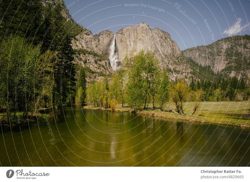 View of river and waterfalls in Yosemite Valley. May 2022 Sunlight Filmlook Tourism Landmark Light warm Tourist Sky Copy Space vacation Vacation mood movie