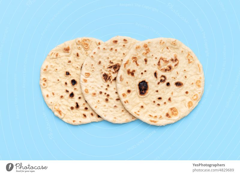 Indian flatbreads on a blue background, above view. Homemade naan bread afghan aligned arabic arranged asian baked bakery classic color cuisine delicious