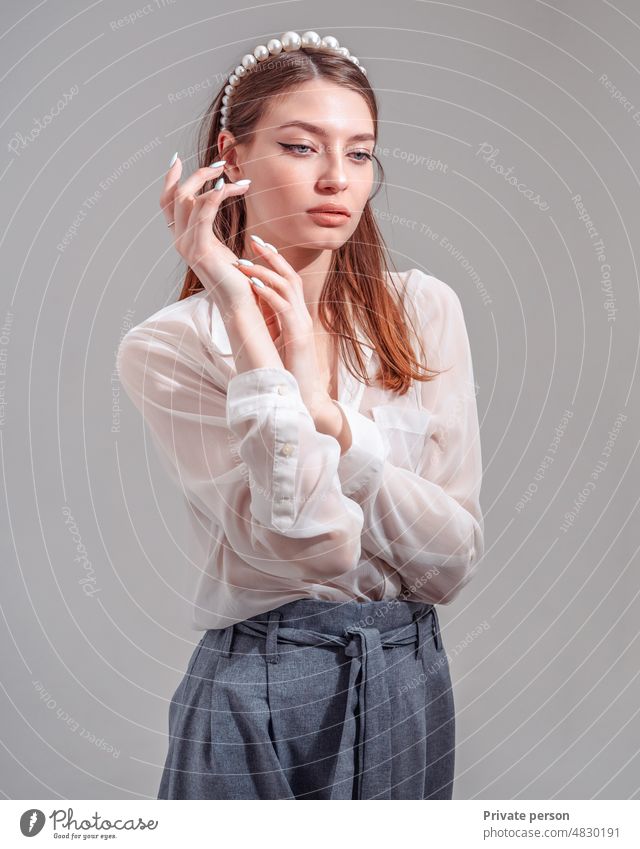 Thinking outside the box. Cute portrait of a young beautiful woman with adult thinking look, she looks down and thinks about something teenager girl student